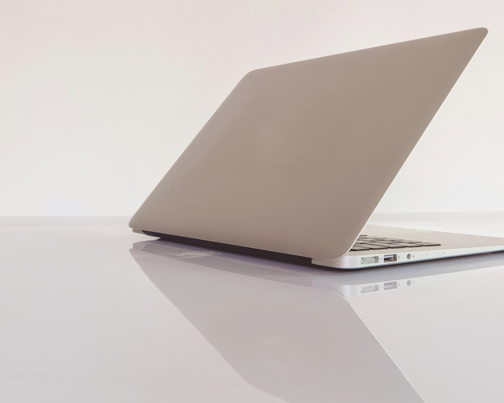 Laptop on a calm desk, pick a plan
